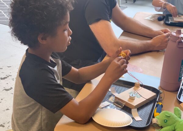 Photo of student building a robot