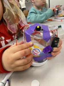 Photo of a kid-made robot in the child's hands