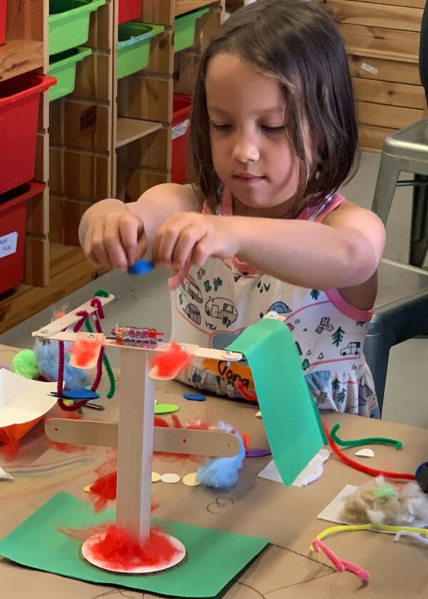 Photo of student building a robot