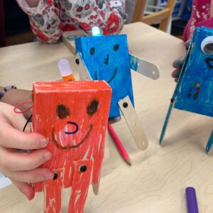 Photo of 3 kid-made robots on a tabletop