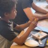 Photo of student building a robot