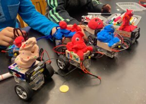 Photo of four kid-made robots on a tabletop