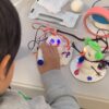 Photo of student building snowbot robots