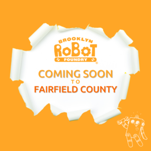 Illustration that resembles an orange wall or paper ripped open, with the Brooklyn Robot Foundry logo and the words "Coming Soon to Fairfield County" in the white opening.