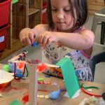 Photo of student building a robot