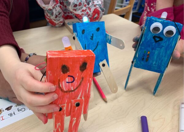 Photo of 3 kid-made robots on a tabletop