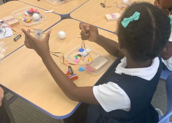 Photo of student building a robot