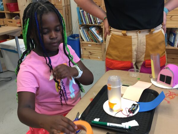 Photo of student building a robot