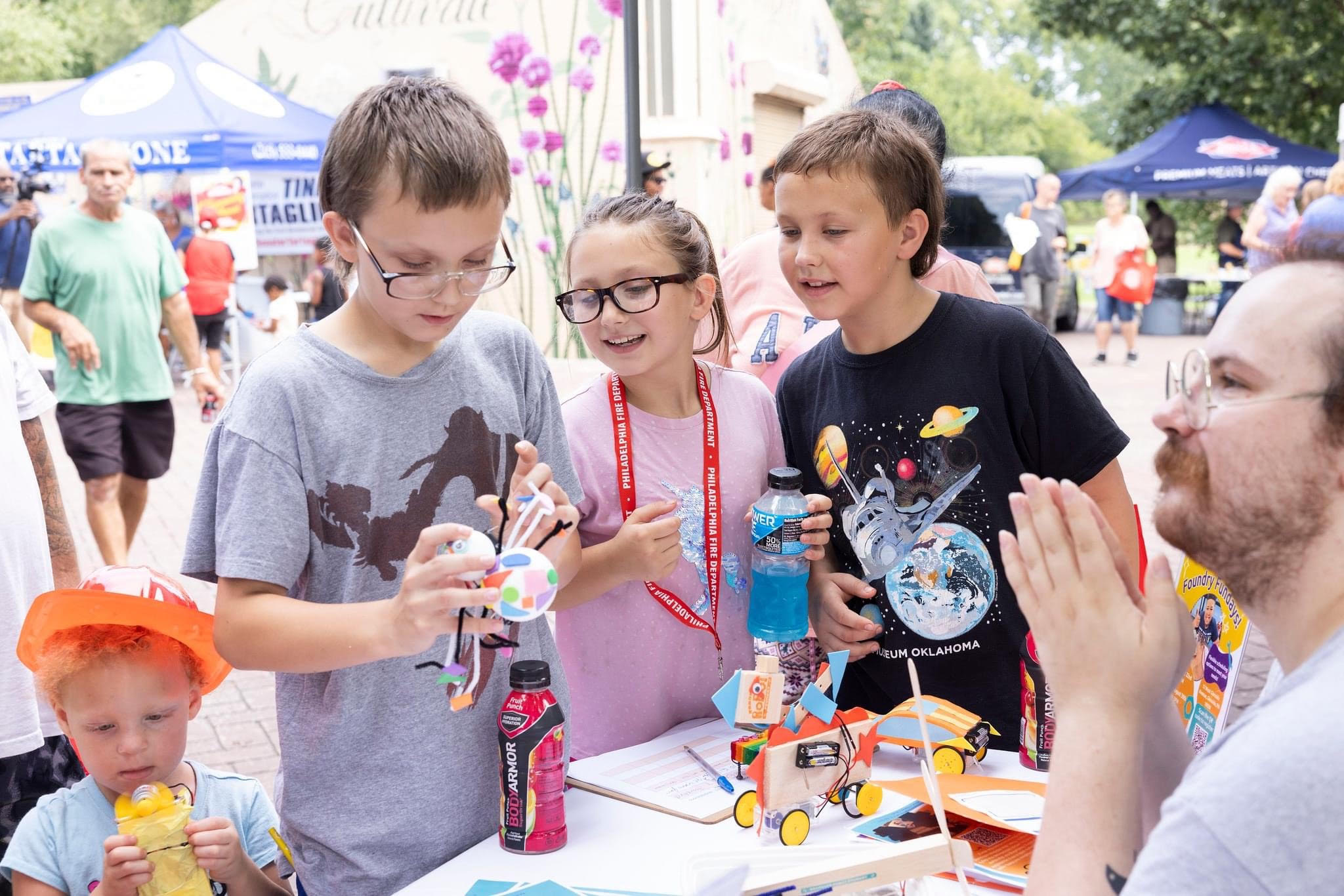 Three kids exploring hands-on robotics Three kids exploring hands-on robotics
