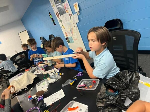 Child working with a robot at Fishtown Recreation Center class