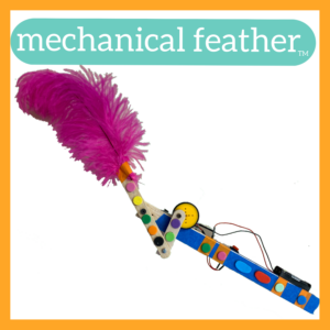 Photograph of a Mechanical Feather robot with an orange frame around it and the words "mechanical feather tm" in white lettering in a purple bubble