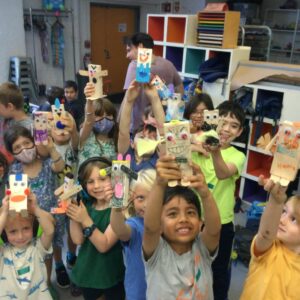 Happy kids holding robots