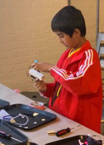 Photo of student building a robot