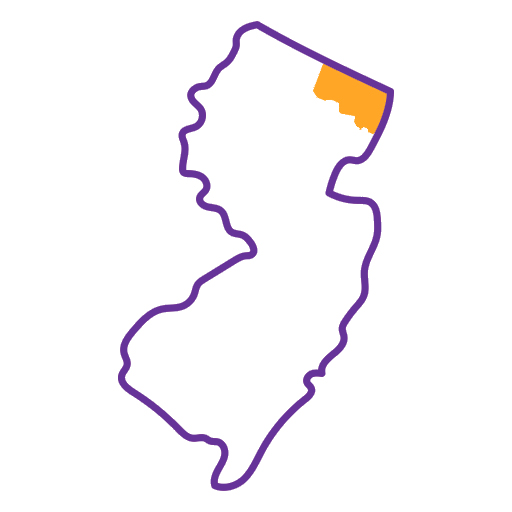 A simple outline of New Jersey in purple with one area in the top right in orange, representing the territory of upper Bergen County.